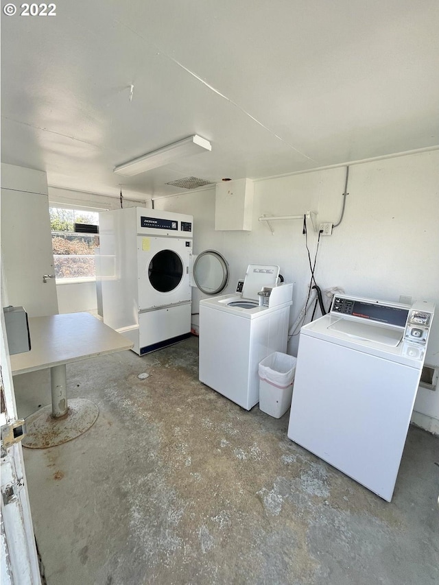 clothes washing area featuring washer and dryer