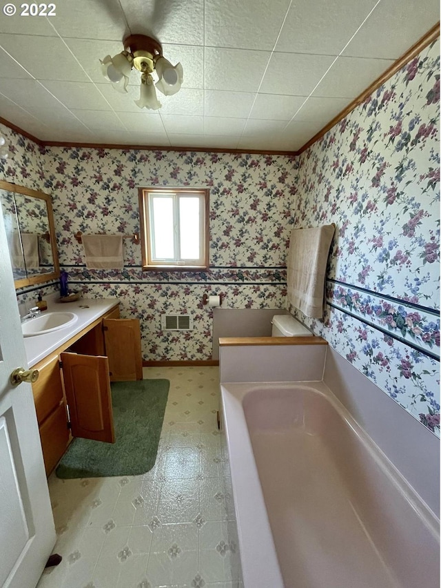 bathroom featuring vanity, tile flooring, a bathing tub, and ceiling fan