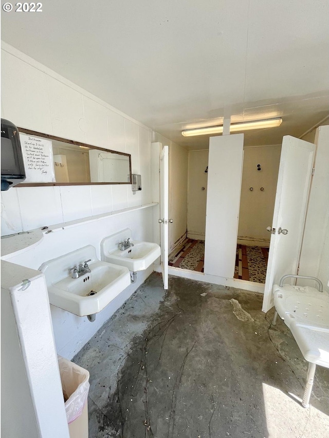 bathroom with concrete floors and sink