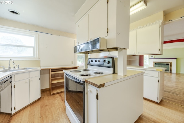 412 W 17th Ave, Eugene, OR 97401 - kitchen with white range with electric stovetop, dishwasher, light wood-type flooring, and healthy amount of natural light