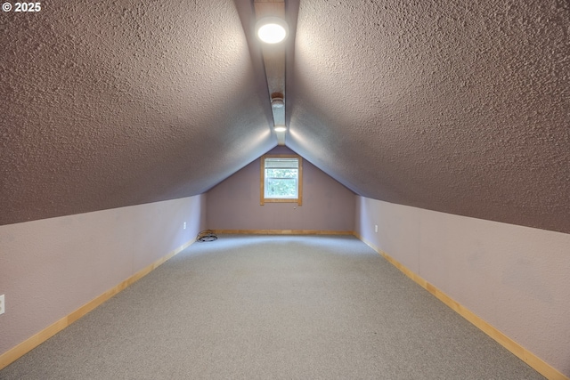 412 W 17th Ave, Eugene, OR 97401 - bonus room featuring vaulted ceiling, a textured ceiling, carpet flooring, and baseboards