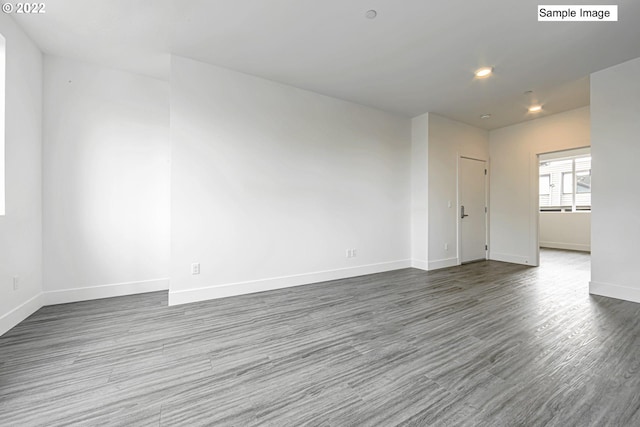 spare room featuring dark hardwood / wood-style floors