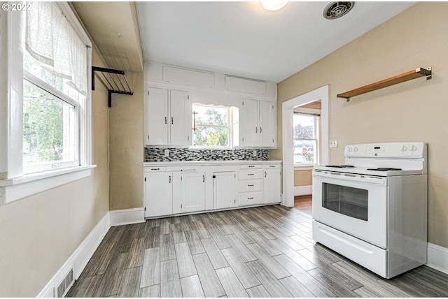 kitchen featuring white cabinetry, electric stove, and light wood-type flooring