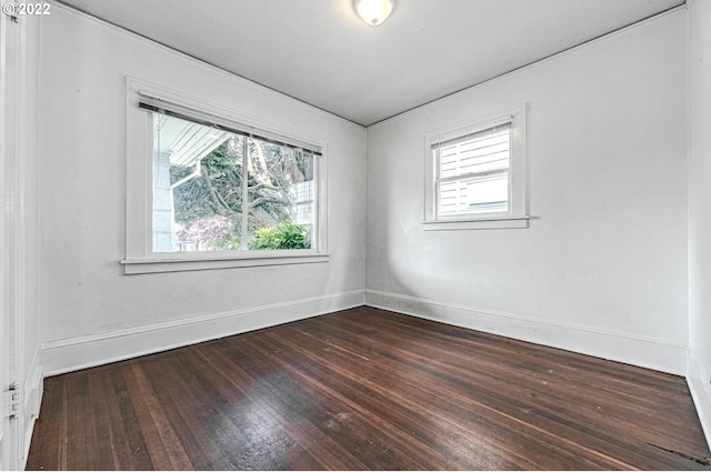 spare room featuring dark hardwood / wood-style floors