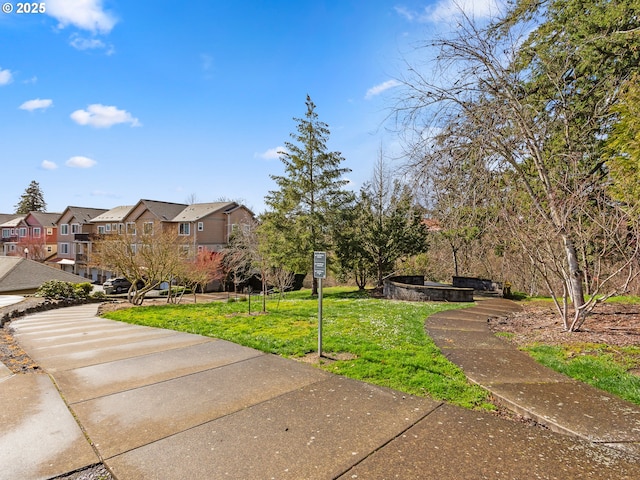 635 NW Lost Springs Ter Unit 104, Portland, OR 97229 - view of front of house with a residential view and a front yard