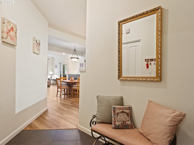 635 NW Lost Springs Ter Unit 104, Portland, OR 97229 - hallway featuring tile patterned flooring and baseboards