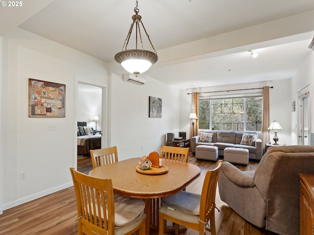 635 NW Lost Springs Ter Unit 104, Portland, OR 97229 - dining area with light wood-style flooring and baseboards