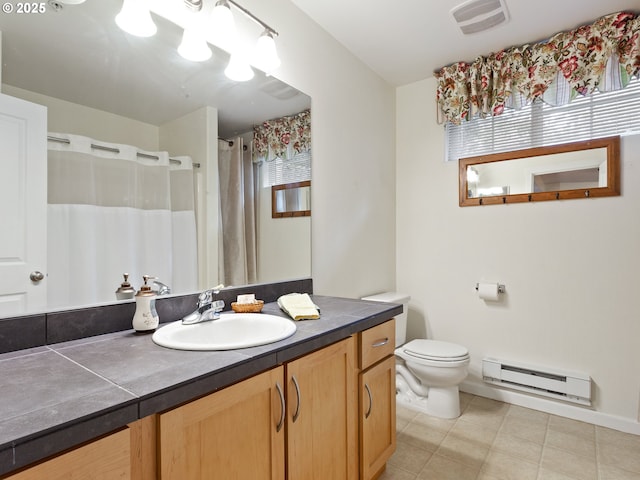 635 NW Lost Springs Ter Unit 104, Portland, OR 97229 - full bath with baseboard heating, vanity, tile patterned flooring, toilet, and a shower with curtain