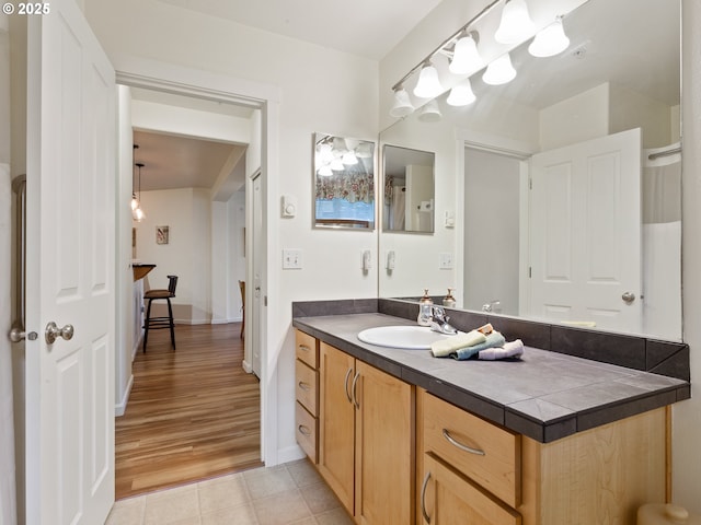 bathroom with tile patterned floors and vanity