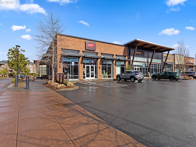 view of property with uncovered parking