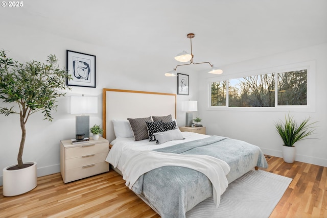 bedroom with light hardwood / wood-style flooring