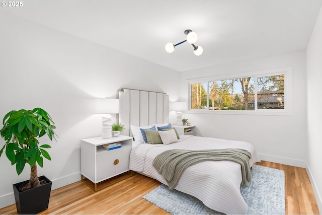 bedroom with hardwood / wood-style floors