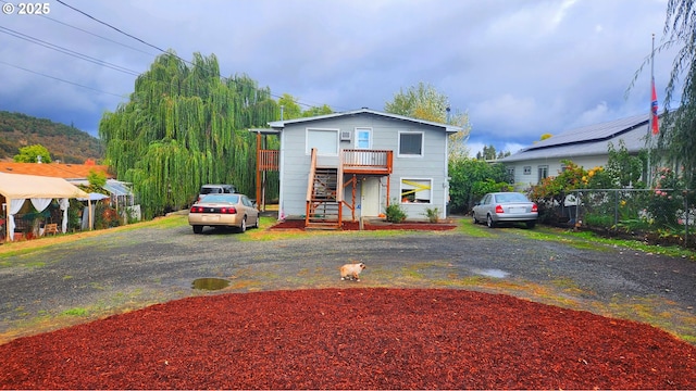 260 Pleasant Ave, Roseburg, OR 97470 - view of front of property featuring stairs, fence, a wooden deck, and driveway