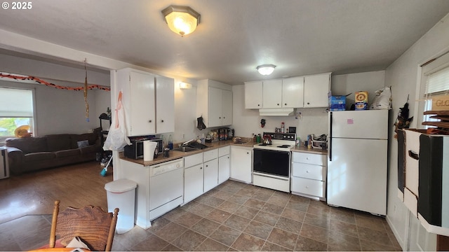260 Pleasant Ave, Roseburg, OR 97470 - kitchen featuring white appliances, white cabinets, under cabinet range hood, and a sink
