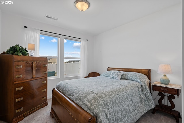 carpeted bedroom with visible vents