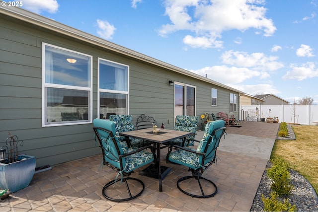 view of patio / terrace featuring fence and outdoor dining space
