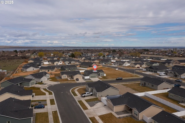birds eye view of property with a residential view