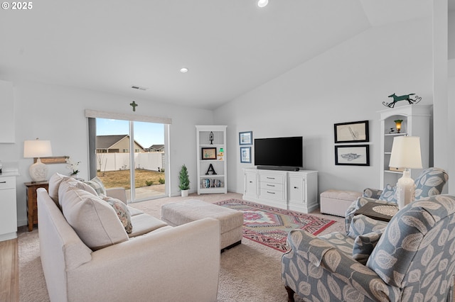 living room featuring light carpet, visible vents, recessed lighting, and high vaulted ceiling