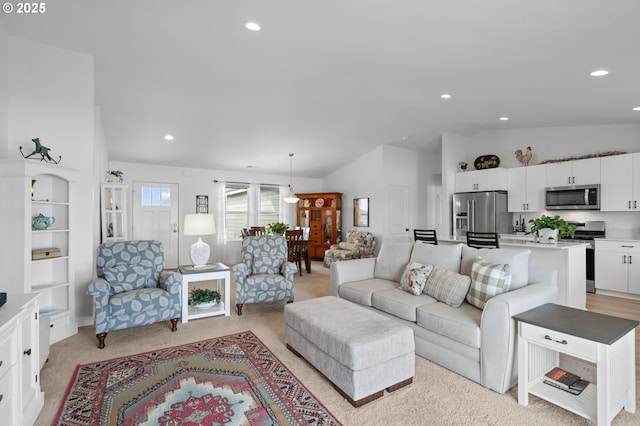 living area featuring light colored carpet, lofted ceiling, and recessed lighting