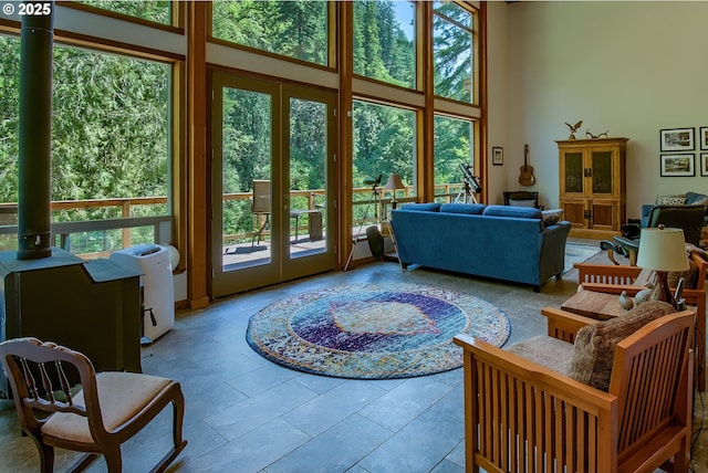 living room with a wealth of natural light and a high ceiling