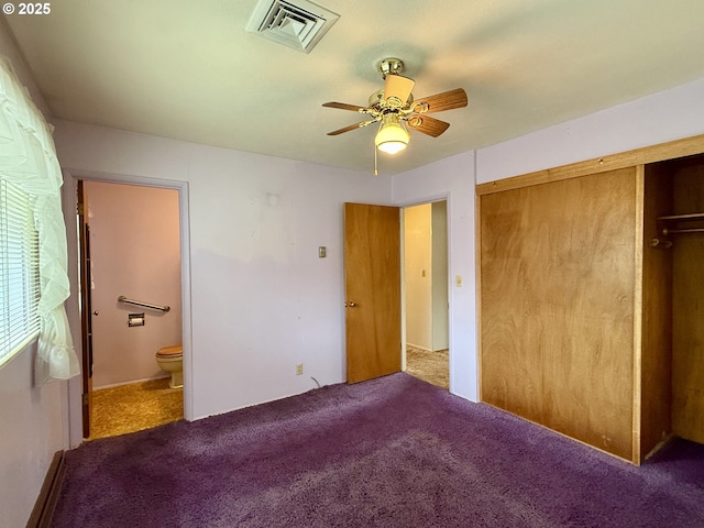 unfurnished bedroom featuring ensuite bath, a closet, ceiling fan, and carpet