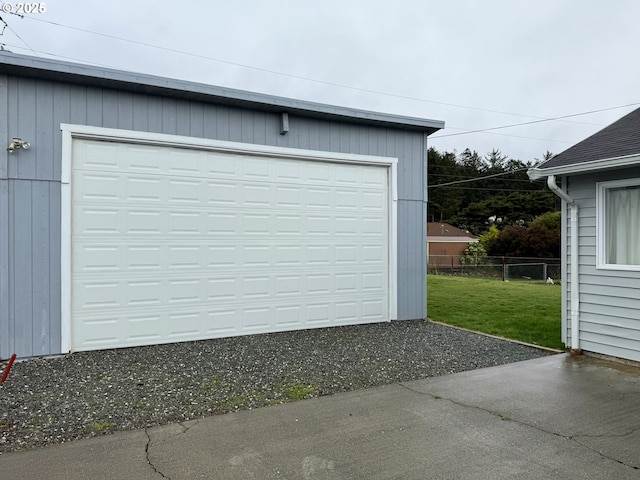 garage featuring a lawn