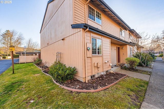 view of property exterior with a yard