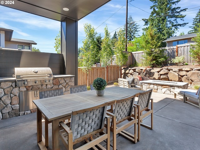 view of patio with an outdoor kitchen and area for grilling