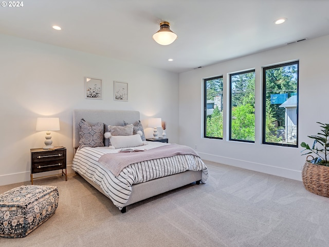 bedroom with light colored carpet