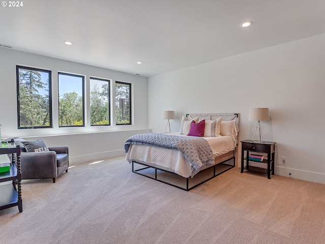 bedroom featuring light colored carpet