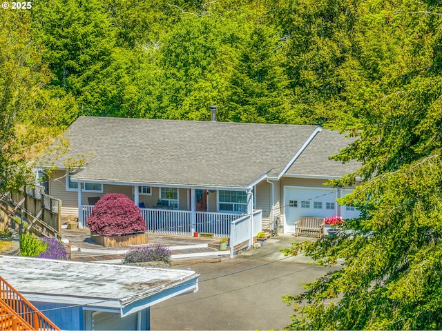 946 E 9th Pl, Coquille, OR 97423 - single story home with a porch and a shingled roof