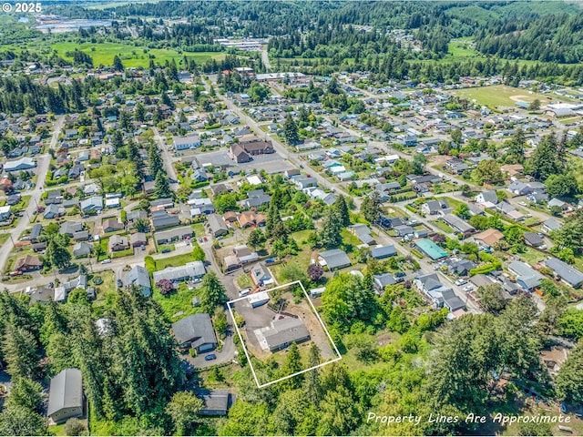 946 E 9th Pl, Coquille, OR 97423 - aerial perspective of suburban area featuring property boundaries highlighted and a forest