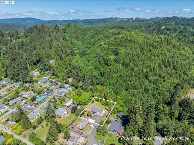 946 E 9th Pl, Coquille, OR 97423 - view of property location featuring a heavily wooded area, property boundaries highlighted, and mountains