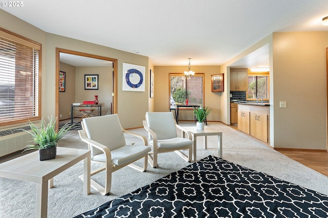 living room featuring an inviting chandelier