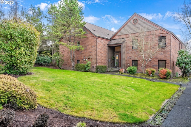 view of front of home with a front lawn