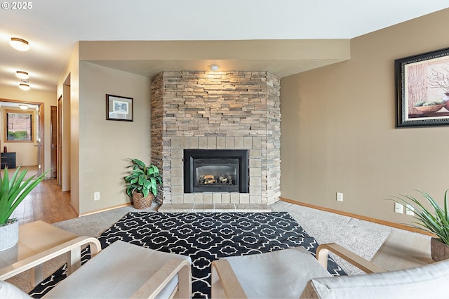 living room featuring carpet floors and a fireplace