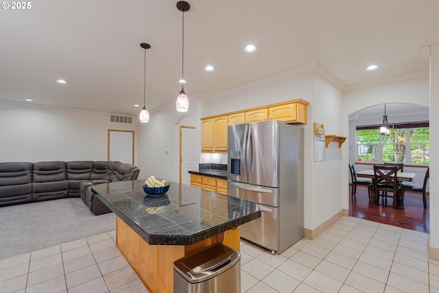 61 SW Wallingford Way, Beaverton, OR 97006 - kitchen featuring stainless steel fridge, tile counters, arched walkways, light tile patterned floors, and open floor plan