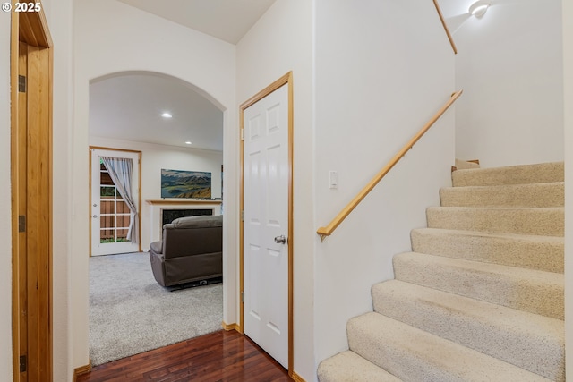 61 SW Wallingford Way, Beaverton, OR 97006 - stairway featuring arched walkways, wood finished floors, and recessed lighting