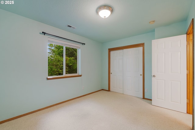 61 SW Wallingford Way, Beaverton, OR 97006 - unfurnished bedroom with a closet, baseboards, and carpet