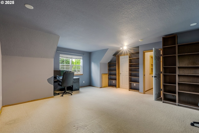 61 SW Wallingford Way, Beaverton, OR 97006 - home office featuring a textured ceiling, carpet, baseboards, and lofted ceiling