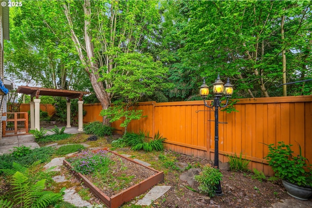 61 SW Wallingford Way, Beaverton, OR 97006 - fenced backyard featuring a garden