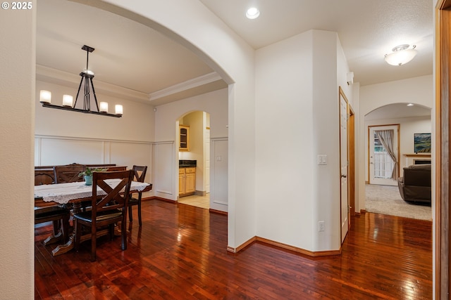 61 SW Wallingford Way, Beaverton, OR 97006 - dining area featuring wood-type flooring, crown molding, baseboards, a chandelier, and recessed lighting