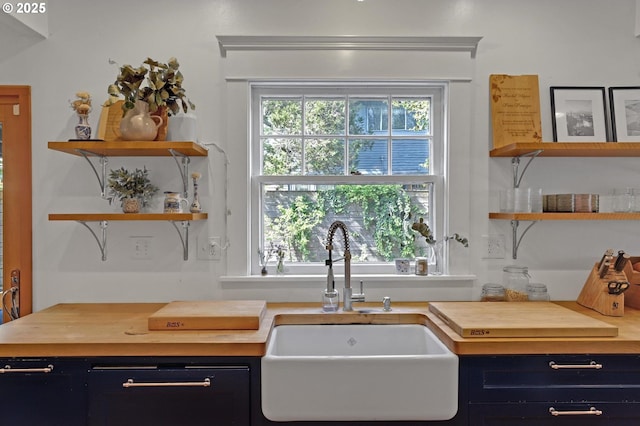 3701 NE Davis St, Portland, OR 97232 - kitchen featuring open shelves, butcher block countertops, blue cabinets, and dark cabinets