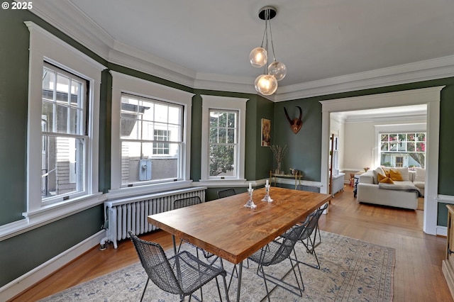 3701 NE Davis St, Portland, OR 97232 - dining space featuring radiator, ornamental molding, and healthy amount of natural light