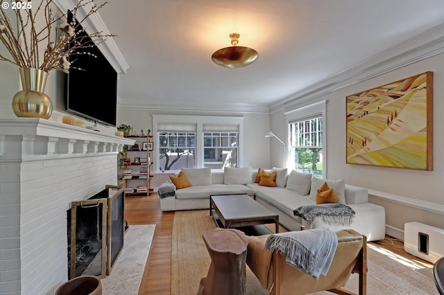 3701 NE Davis St, Portland, OR 97232 - living area with ornamental molding, a fireplace, and light wood-type flooring