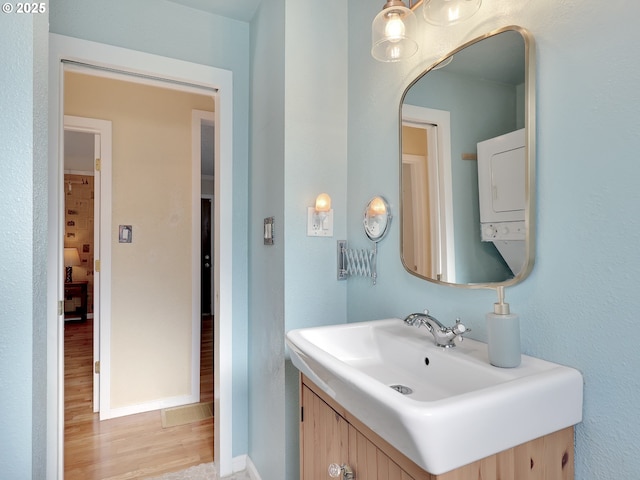 1466 8th St, Astoria, OR 97103 - bathroom featuring wood finished floors, vanity, and baseboards