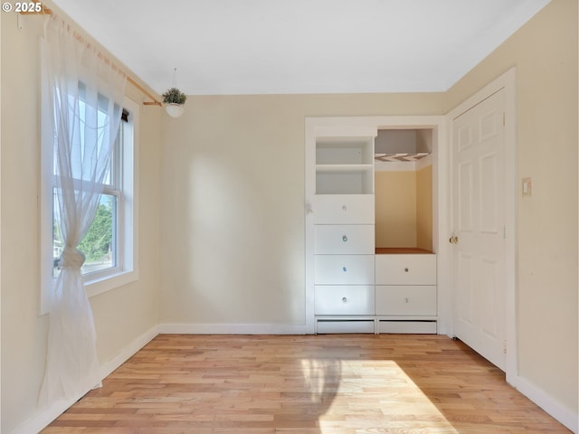 1466 8th St, Astoria, OR 97103 - unfurnished bedroom featuring light wood-type flooring and baseboards