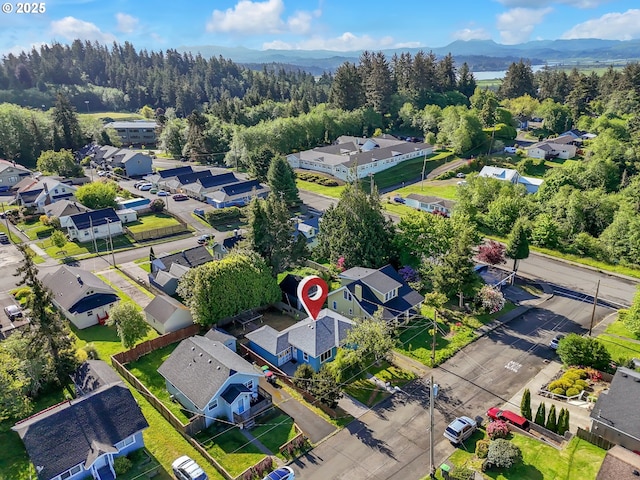 1466 8th St, Astoria, OR 97103 - aerial view of residential area featuring mountains and a forest