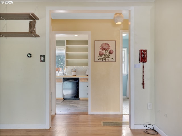 1466 8th St, Astoria, OR 97103 - hall with light wood-style floors and baseboards
