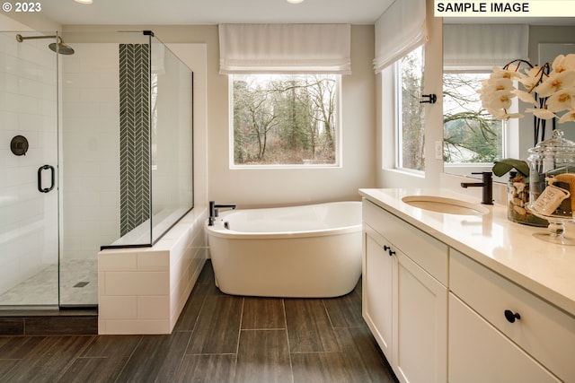 352 S 88th Ave, Ridgefield, WA 98642 - full bathroom with a soaking tub, a stall shower, vanity, wood finished floors, and recessed lighting